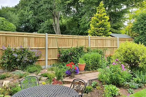 Closeboard fencing with a landscaped garden in East Grinstead