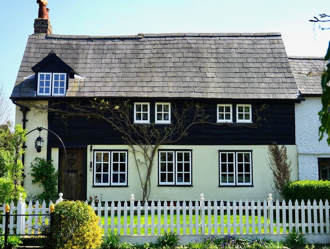 Country cottage with white picket fencing