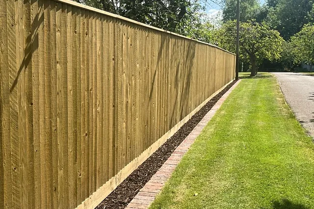 Closeboard timber fencing installation following a curved driveway in East Grinstead, by Green Leaves Fencing & Gates.